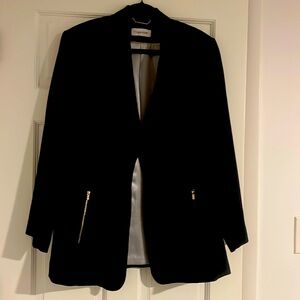 Beautiful Navy Blue Calvin Klein Blazer with dual Zippers for added details.